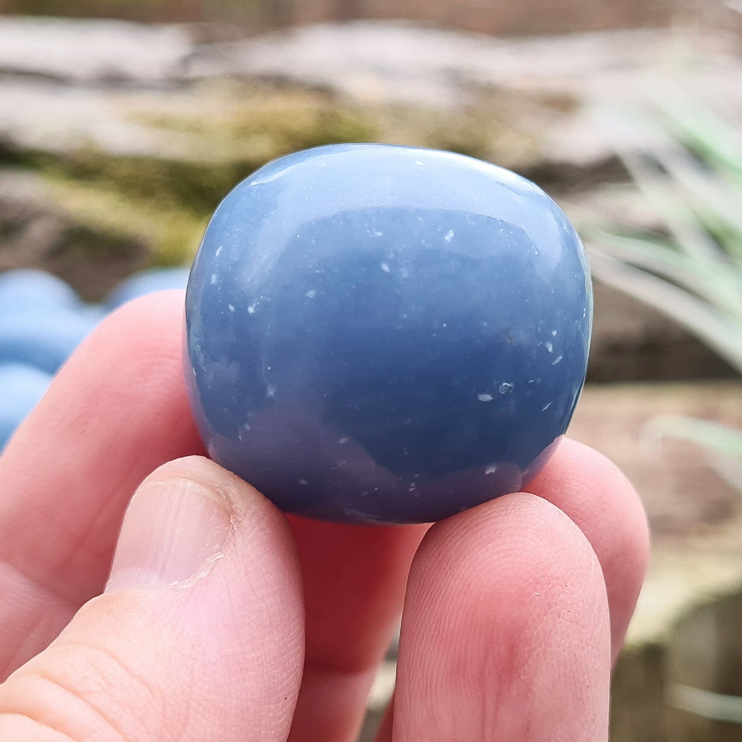 Angelite Extra Large Tumble Stones from Peru feature a soft greyblue tone with natural white flecks of Calcite or Gypsum. Formed from Celestite over millions of years, these soothing stones carry a calming yet grounded presence. Their energy supports communication, compassion, and spiritual connection.
