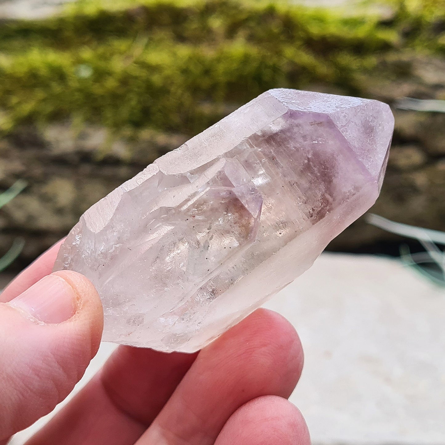 This natural Quartz and Amethyst crystal point from Madagascar features a clear Quartz base with a rich Amethyst tip. Known for its unique energy, this piece is both visually appealing and energetically powerful.