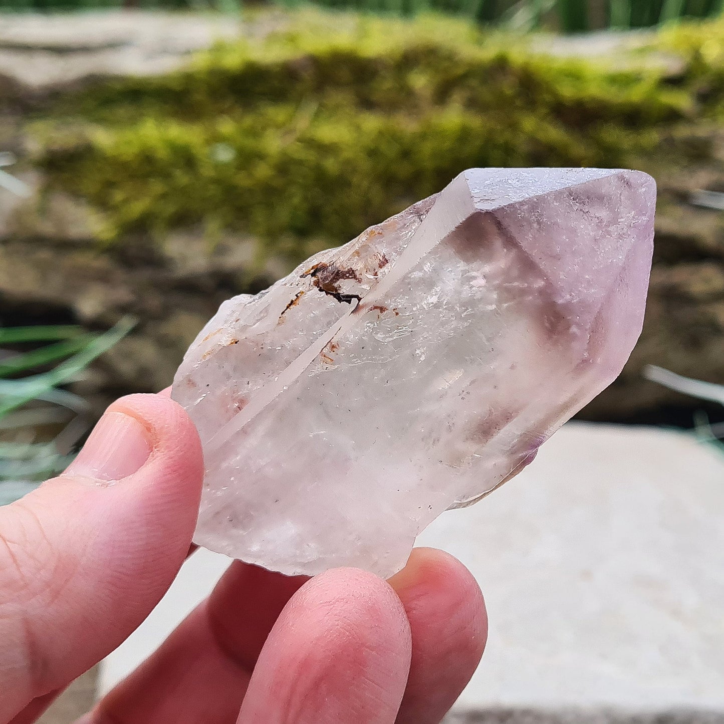 This natural Quartz and Amethyst crystal point from Madagascar features a clear Quartz base with a rich Amethyst tip. Known for its unique energy, this piece is both visually appealing and energetically powerful.