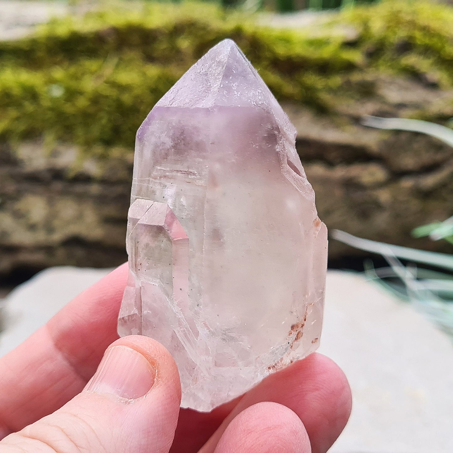 This natural Quartz and Amethyst crystal point from Madagascar features a clear Quartz base with a rich Amethyst tip. Known for its unique energy, this piece is both visually appealing and energetically powerful.