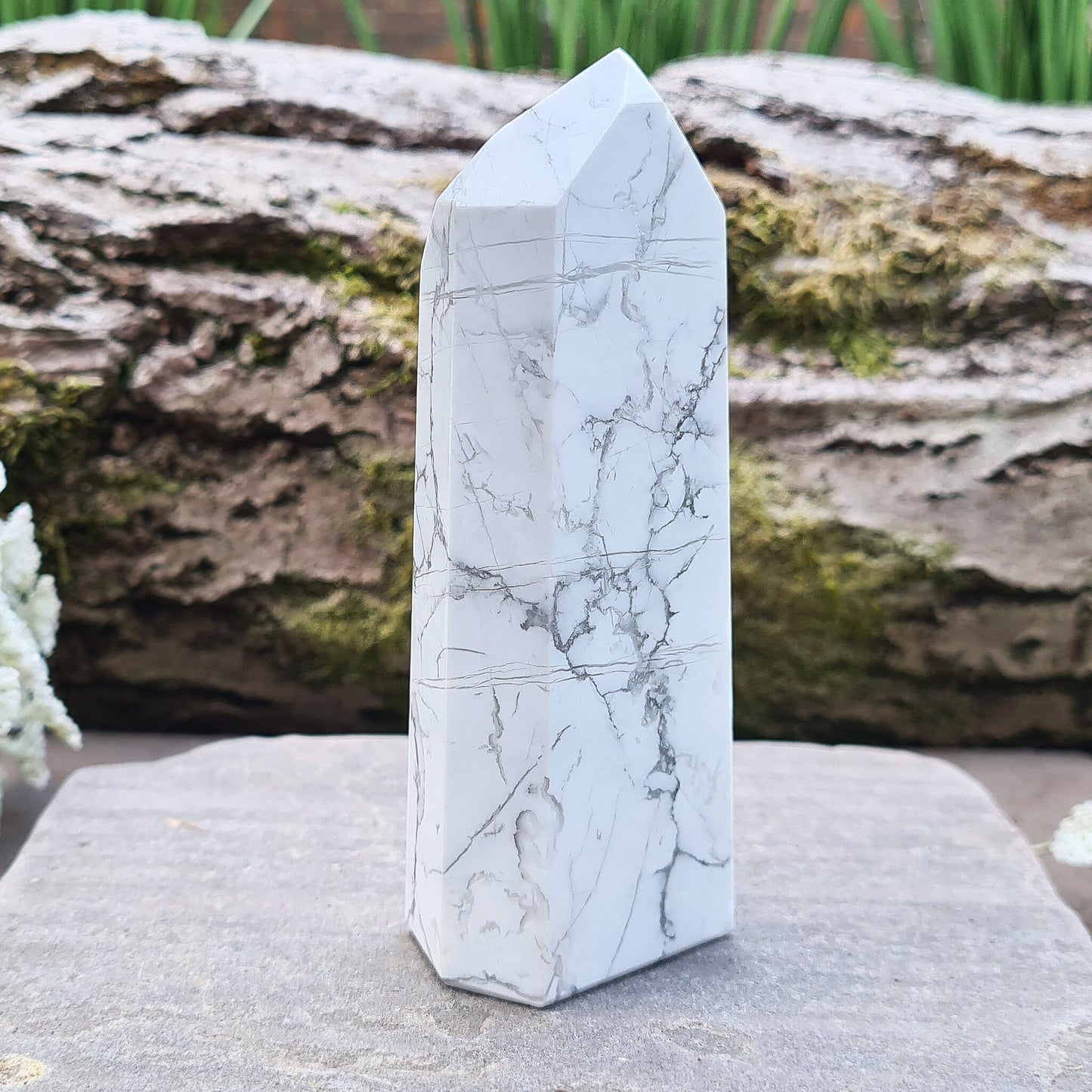 Howlite Crystal Point. Off white with grey marble like patterning, nicely polished.