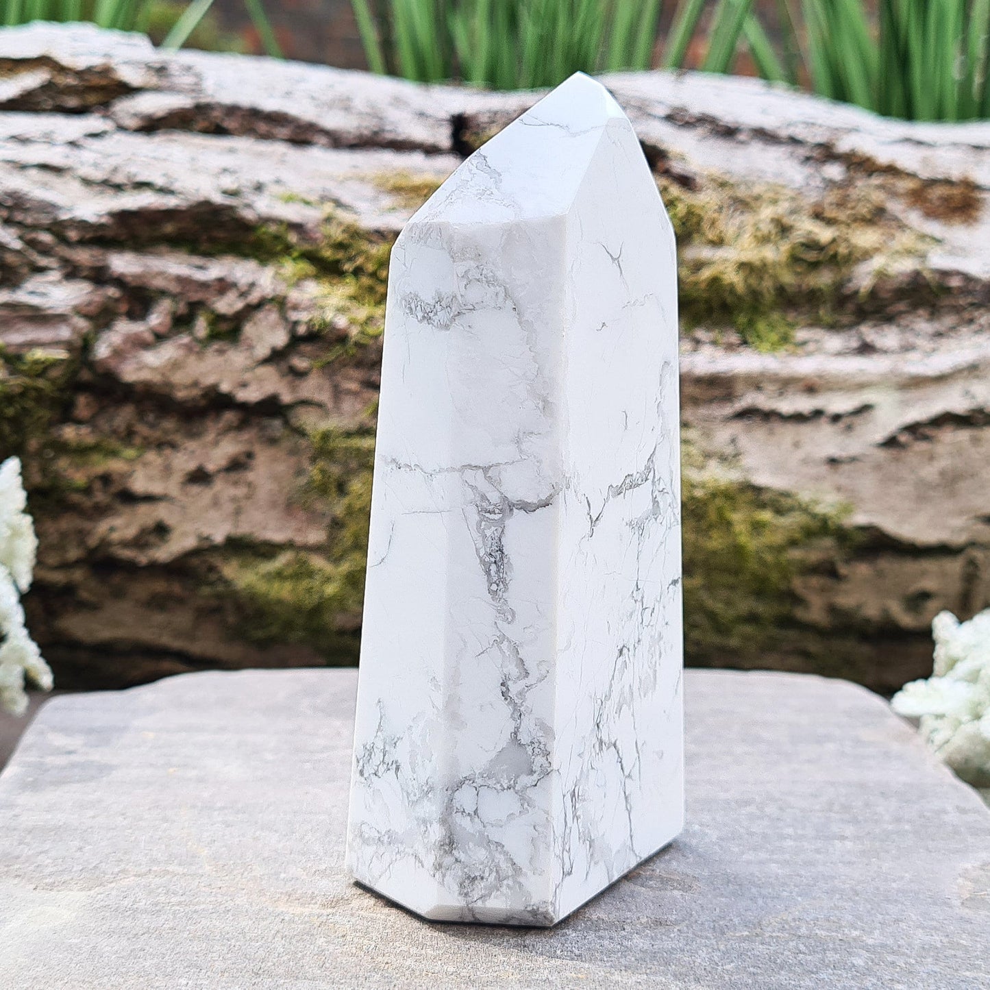 Howlite Crystal Point. Off white with grey marble like patterning, nicely polished.