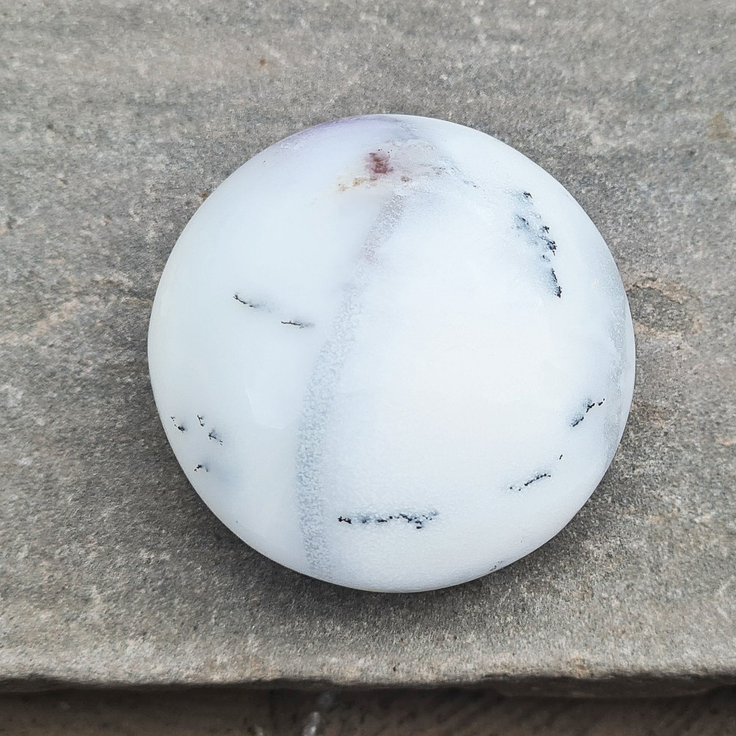 Merlinite Crystal from Madagascar. Fabulous, off white, grey and Lavender colouring. Merlinite Crystals are made up of White Opal and dendritic (fern like) inclusions