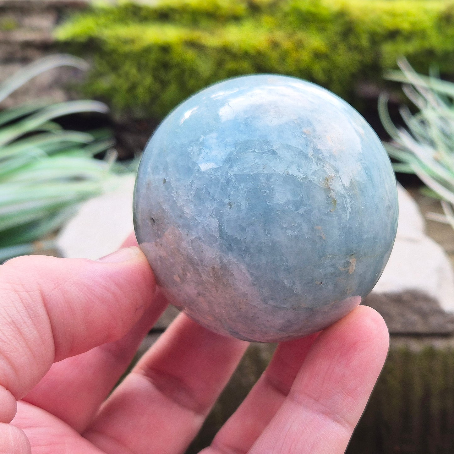 Enhance your space with an Aquamarine crystal sphere. Known for tranquility and clarity, it’s perfect for meditation and decor.