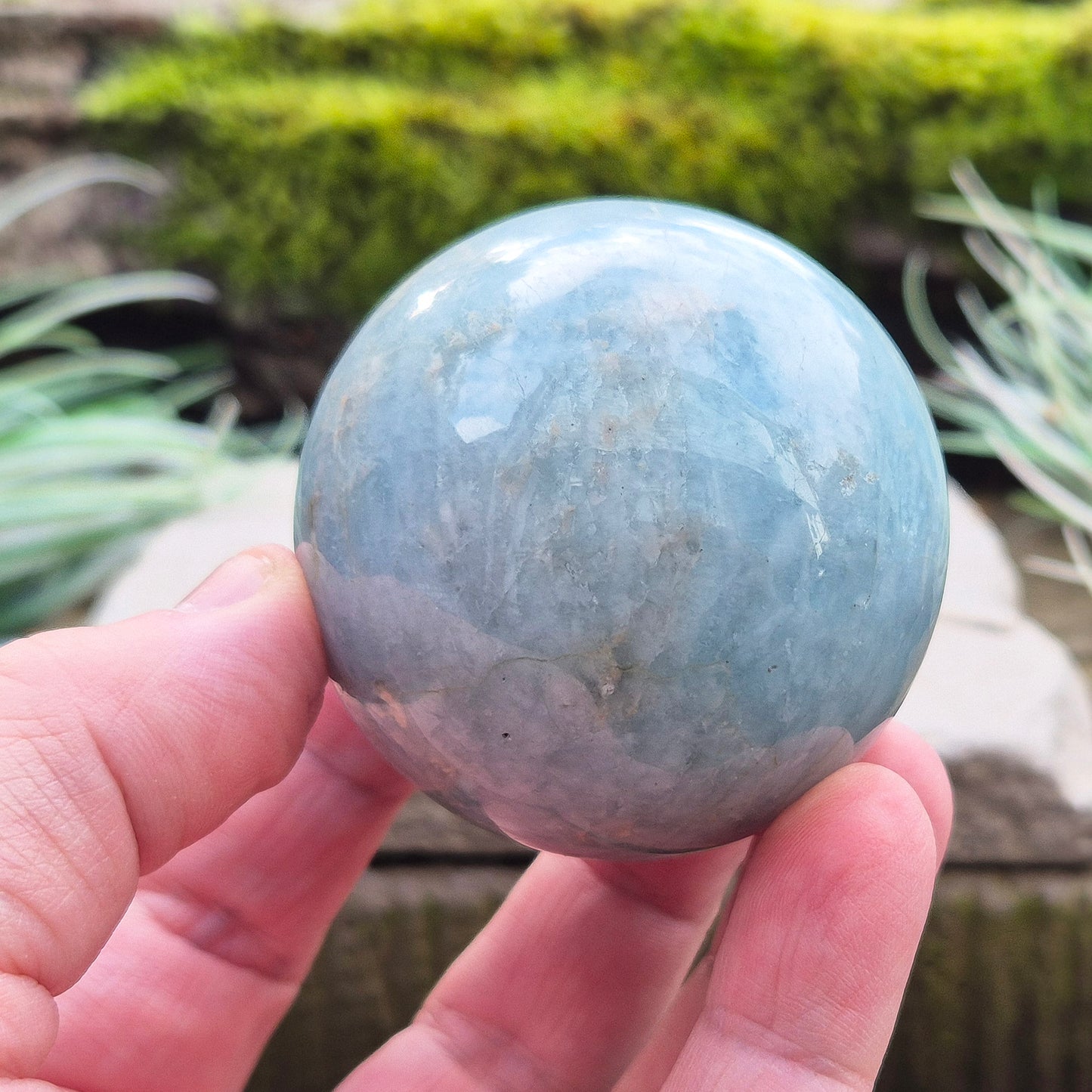 Enhance your space with an Aquamarine crystal sphere. Known for tranquility and clarity, it’s perfect for meditation and decor.