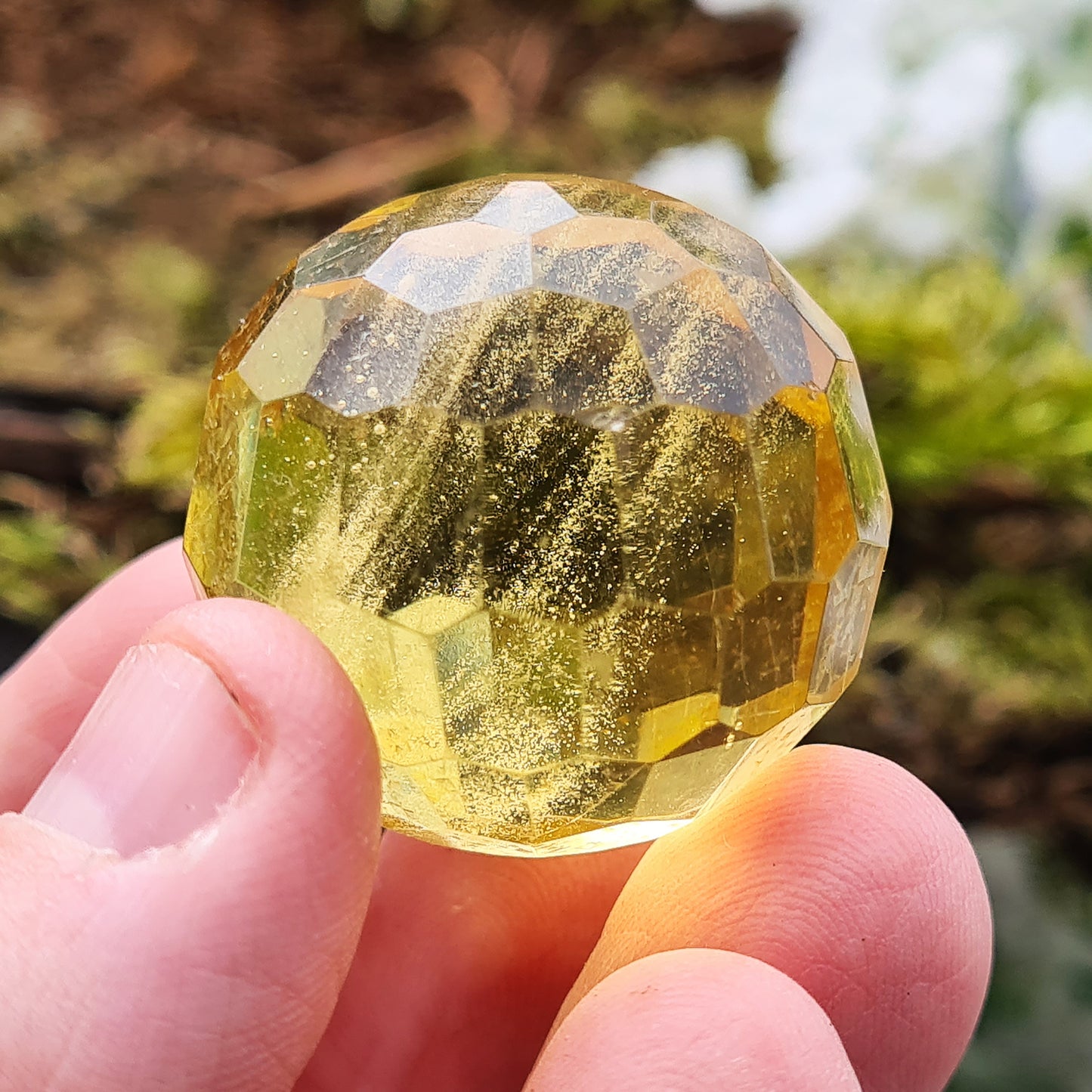 Colombian Copal Amber Faceted Sphere. This has been beautifully crafted.