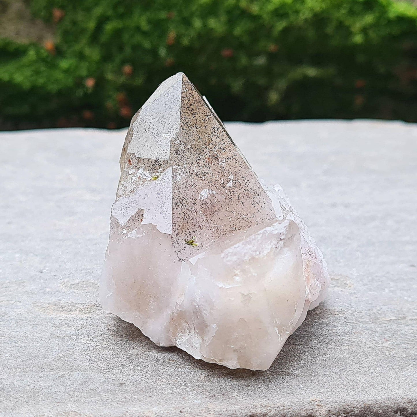 This beautiful Ametrine with Hematite Crystal Standing Point comes from China. A colour shines through in natural light, with a double polished tip, natural body, and a cut base. The addition of Hematite grounds Ametrine’s mental clarity and spiritual uplift, creating a deeply balancing and energising piece.