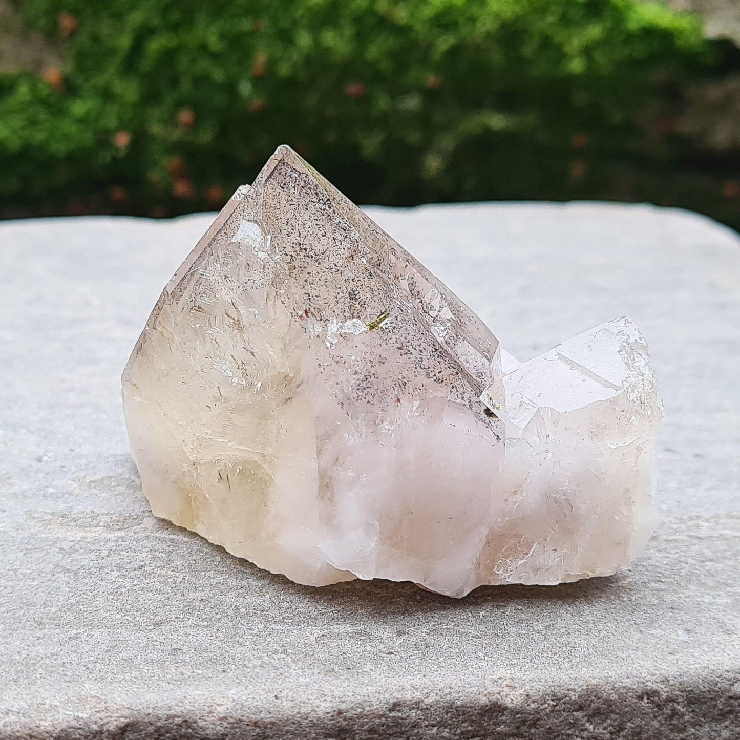 This beautiful Ametrine with Hematite Crystal Standing Point comes from China. A colour shines through in natural light, with a double polished tip, natural body, and a cut base. The addition of Hematite grounds Ametrine’s mental clarity and spiritual uplift, creating a deeply balancing and energising piece.