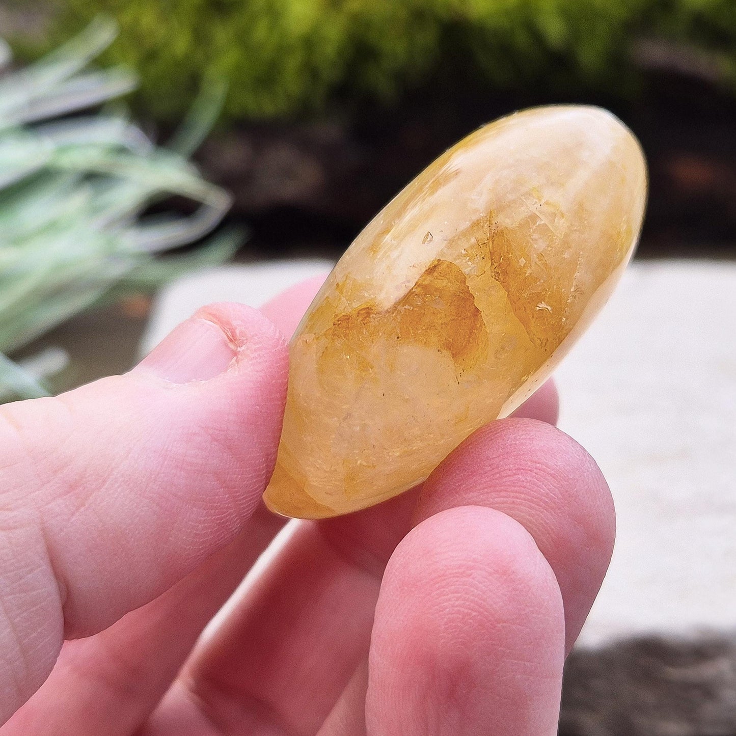 This beautiful Golden Healer Quartz palm stone features natural golden tones created by iron oxide inclusions within the quartz. Polished and sized to fit comfortably in your hand.
