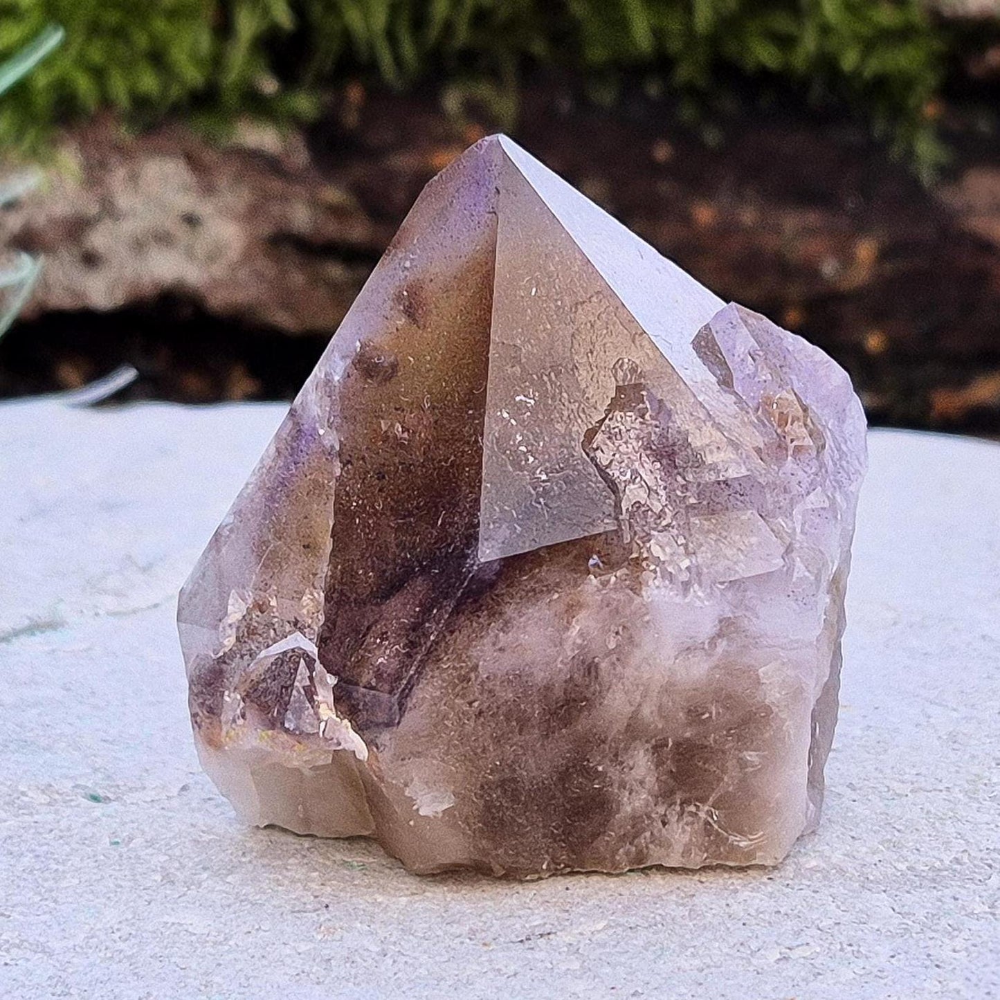 Ametrine Crystal standing point, from the Sichuan Province, China. Color really shows through in the natural light. Polished tip, natural body, cut base.
