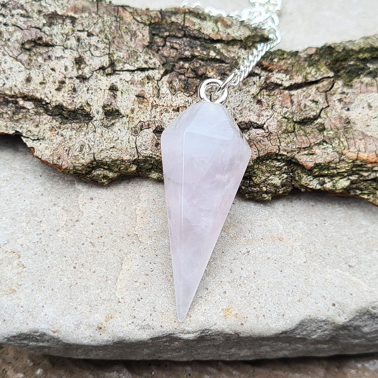 Lunar Rose Quartz Crystal Pendulum or Lunar Quartz Crystal. Is from one source in Namibia. It will come in a box or an organza pouch to keep it in.