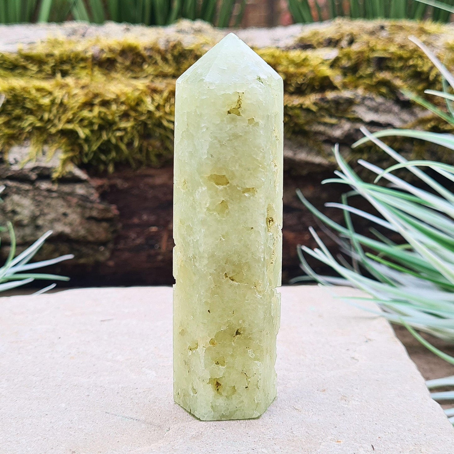Prehnite Crystal Tower, point is a 6 sided Generator, has lovely natural cavities so you can see the crystalline structure within it. The prehnite is a lovely pale green. From Victoria, Australia.