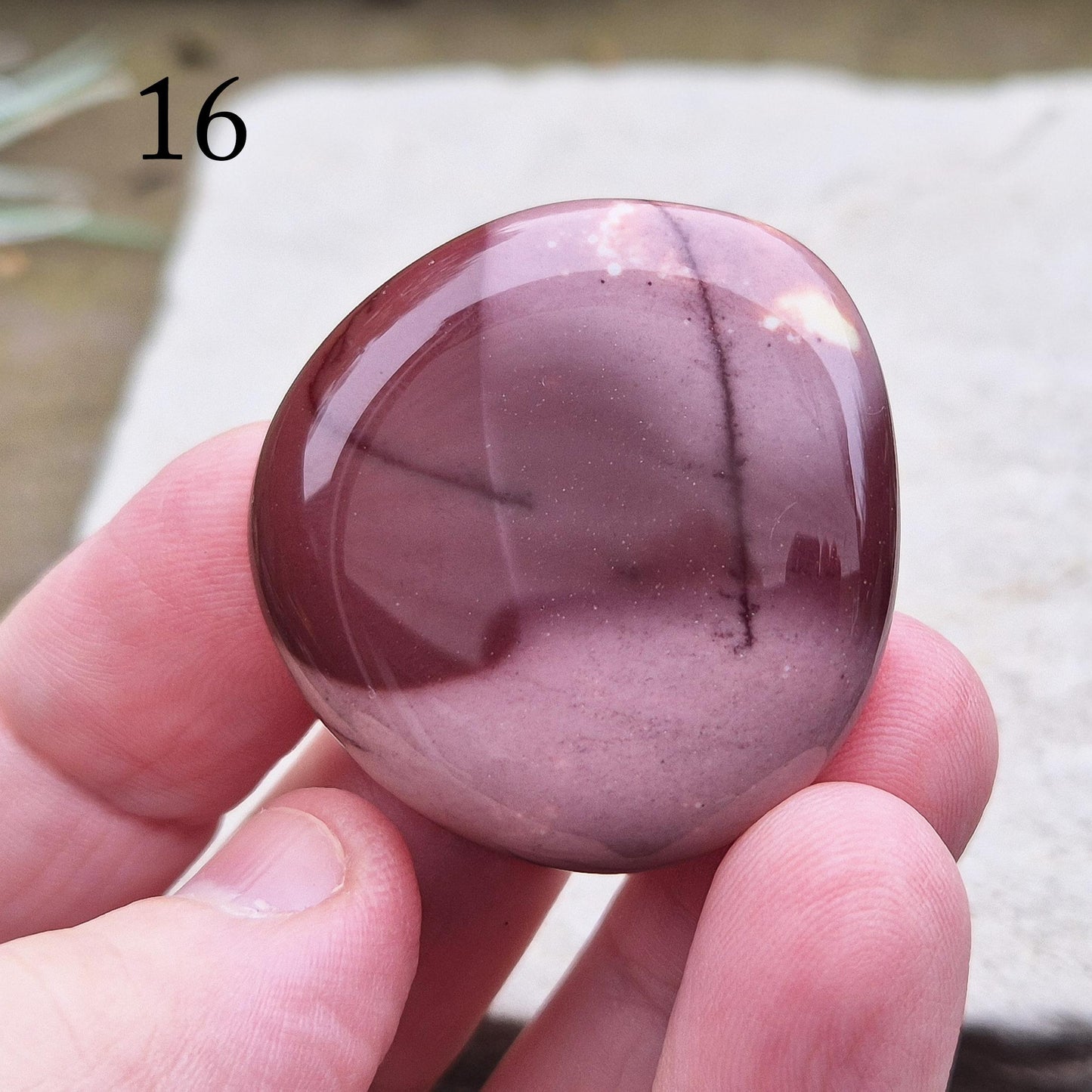 Mookaite Crystal Palm Stone. From the Mooka Creek region in Western Australia, each Mookaite palm stone displays a unique mix of earthy tones—reds, yellows, creams, and purples.