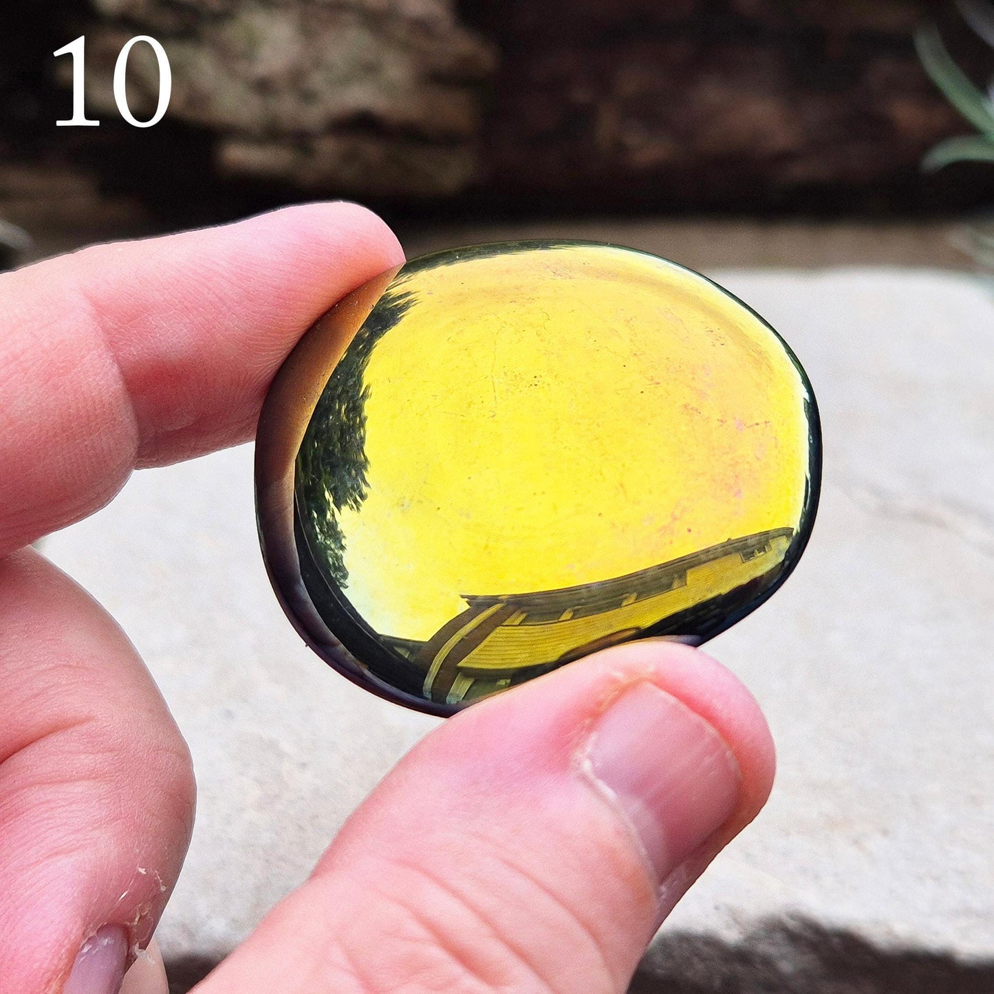 Titanium Aura Obsidian Palm Stone. This vibrant Titanium Aura Obsidian, also known as Rainbow Aura, Mystic Obsidian, Flame Aura, or Dark Rainbow Aura, is sourced from Mexico.