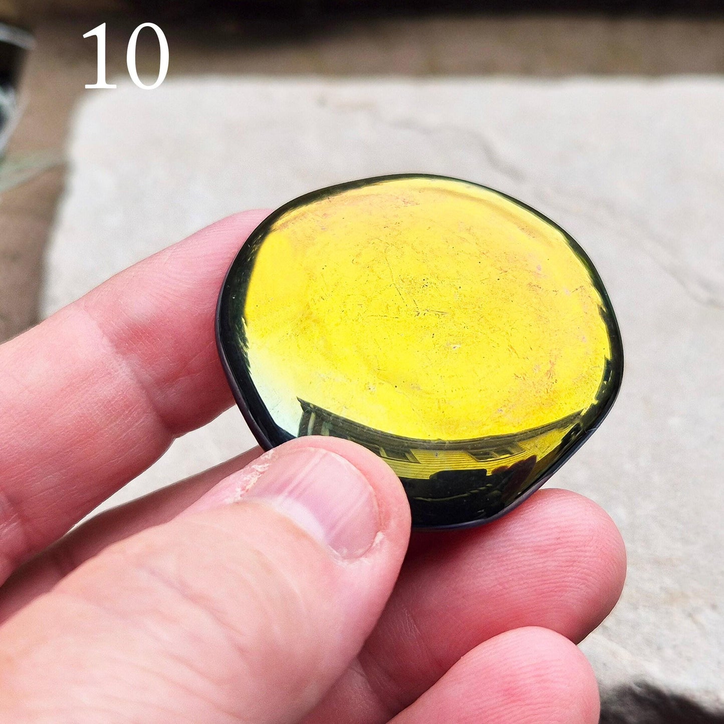 Titanium Aura Obsidian Palm Stone. This vibrant Titanium Aura Obsidian, also known as Rainbow Aura, Mystic Obsidian, Flame Aura, or Dark Rainbow Aura, is sourced from Mexico.