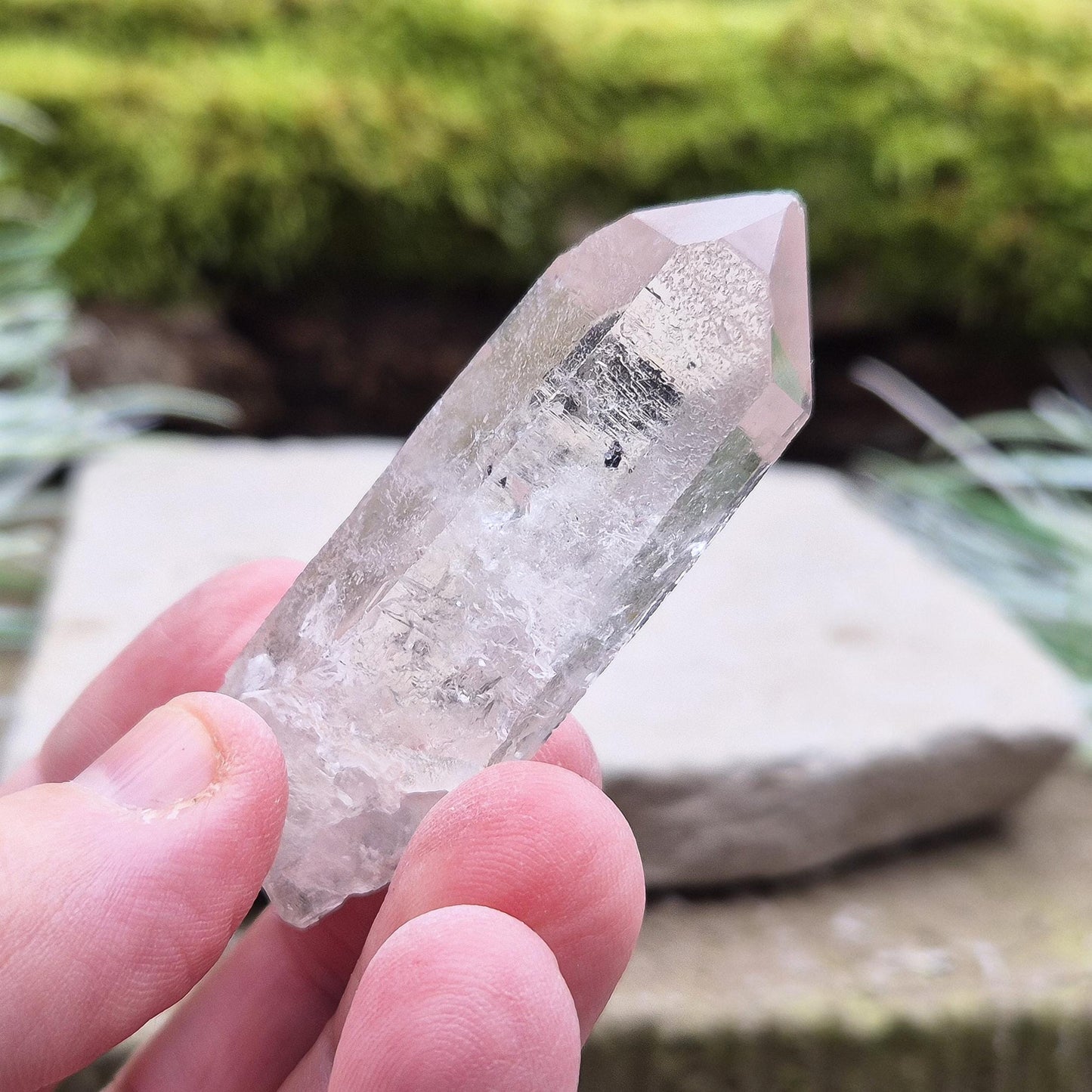 Starbrary Quartz Crystal Point From Brazil. This crystal is a point has nice clarity and lovely Starbrary markings on at least 2 sides.
Starbrary Quartz is known for its clear surfaces etched with geometric shapes like triangles, lines, and symbols.