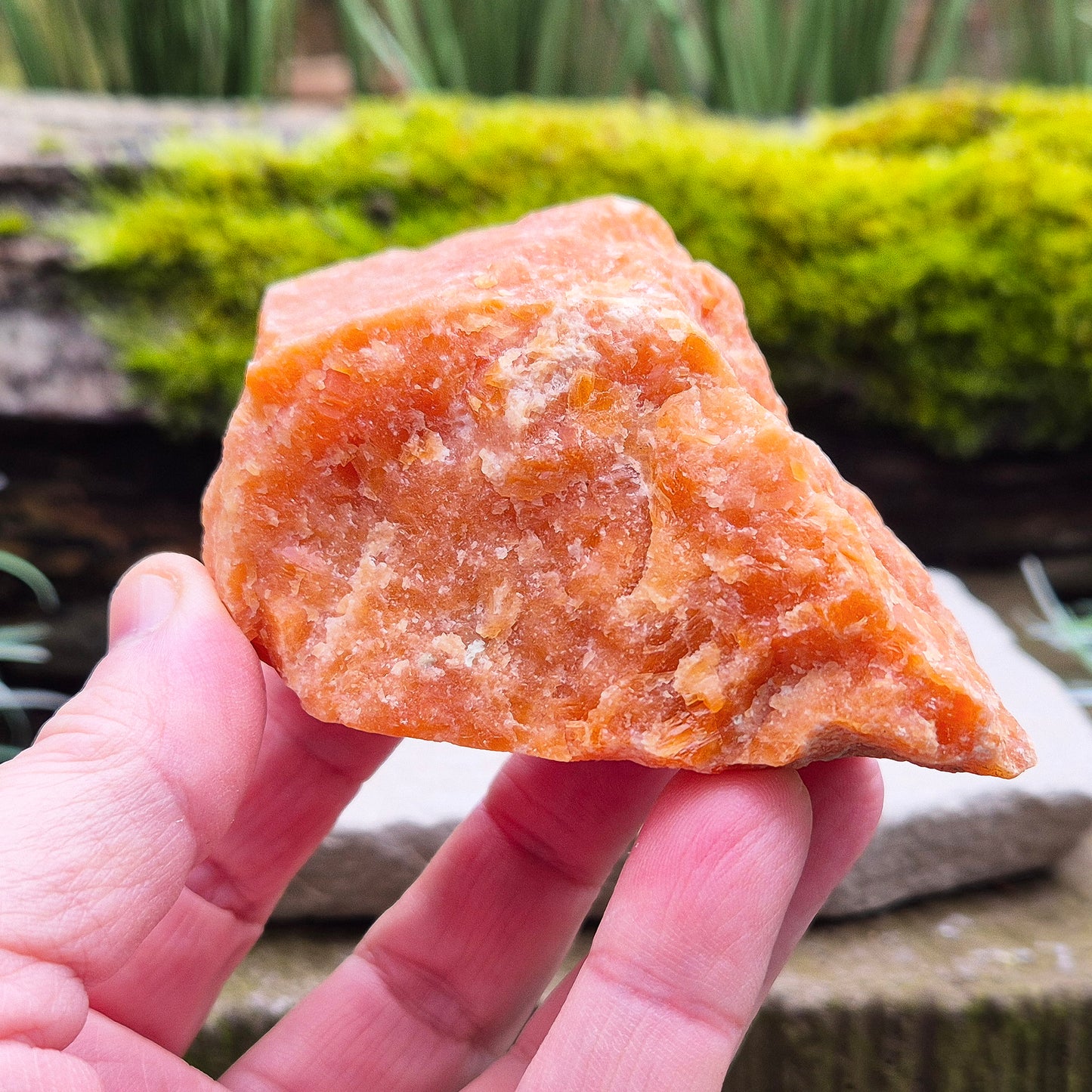Orange Calcite, Natural Piece, Vibrant Color. While this crystal comes from a vein in the mine known for producing an infusion of orange calcite and black tourmaline, this piece appears to outwardly feature only the vibrant orange calcite.