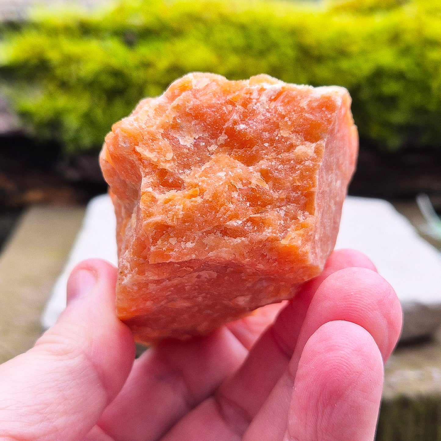 Orange Calcite, Natural Piece, Vibrant Color. While this crystal comes from a vein in the mine known for producing an infusion of orange calcite and black tourmaline, this piece appears to outwardly feature only the vibrant orange calcite.
