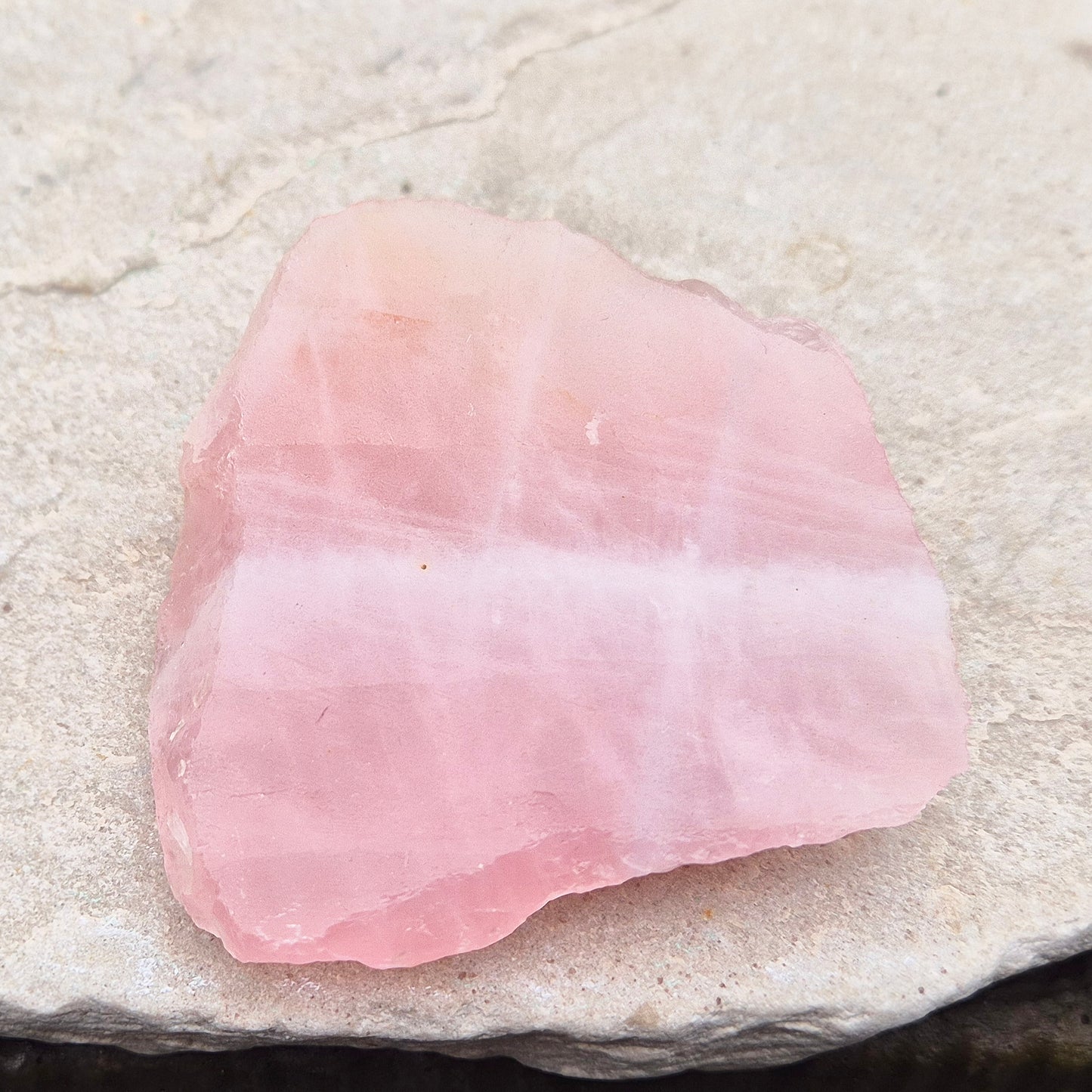 Rose Quartz Crystal Platform from South Africa. One side is left natural and the other side has been cut flat. Great for displaying other crystals and jewellry.