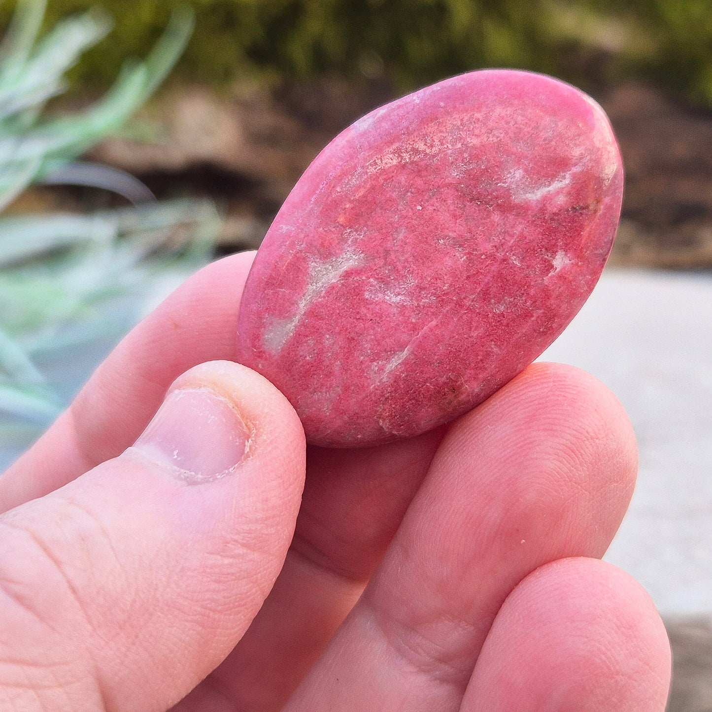 This wonderful Pink Thulite palm stone, also known as Rosaline, features a deep saturated pink colour and fits comfortably in your hand.
