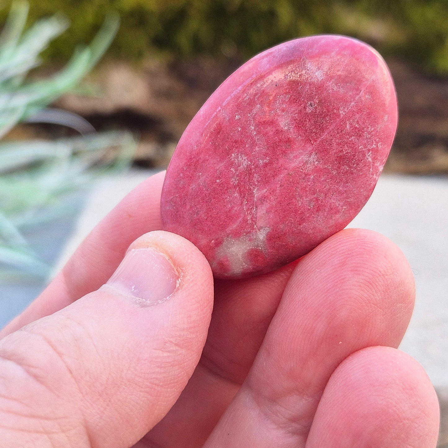 This wonderful Pink Thulite palm stone, also known as Rosaline, features a deep saturated pink colour and fits comfortably in your hand.