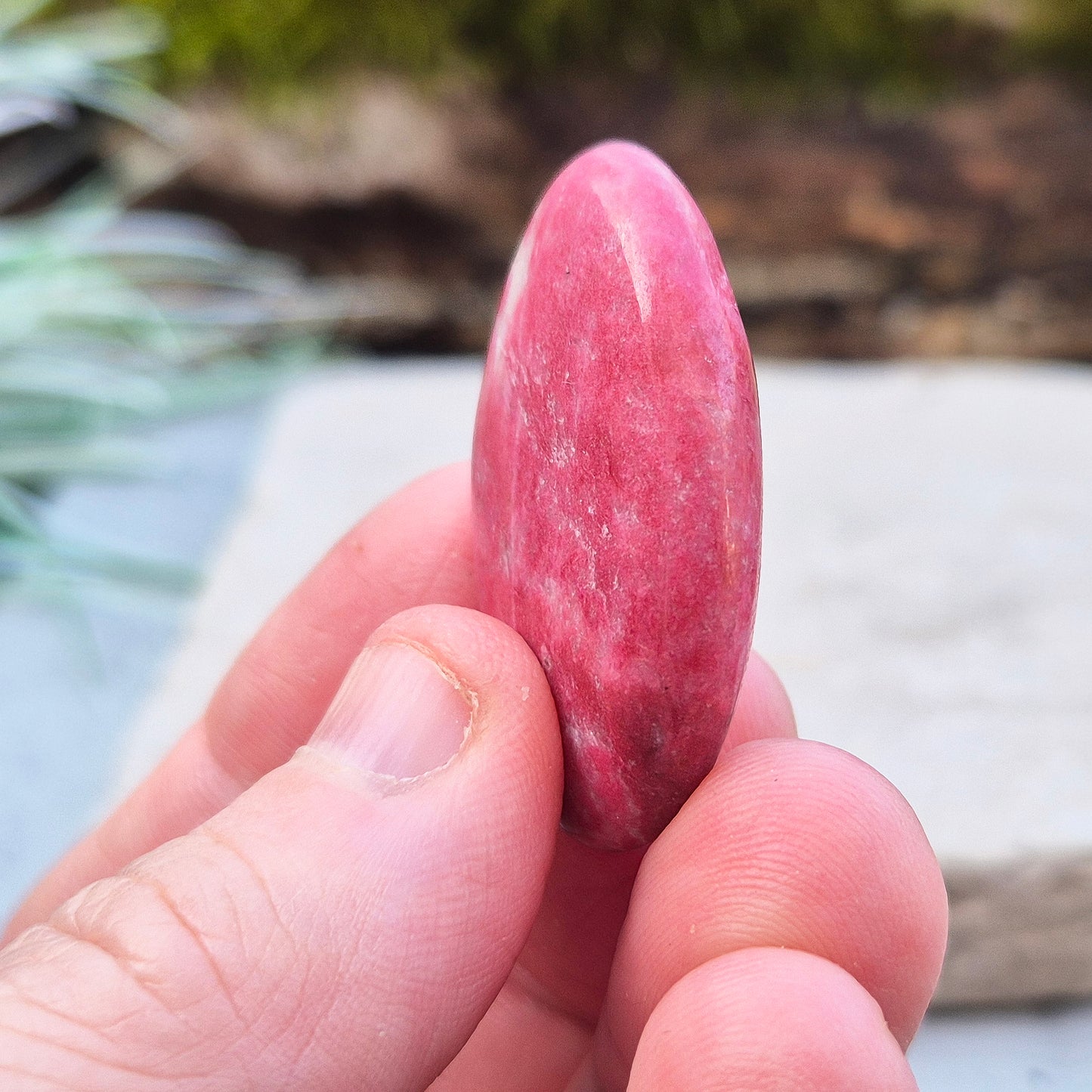 This wonderful Pink Thulite palm stone, also known as Rosaline, features a deep saturated pink colour and fits comfortably in your hand.