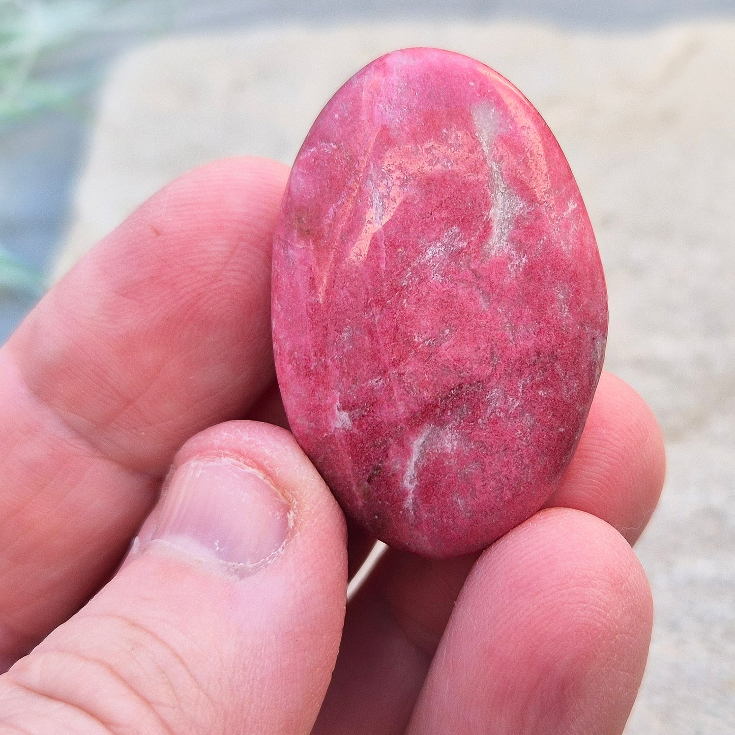 This wonderful Pink Thulite palm stone, also known as Rosaline, features a deep saturated pink colour and fits comfortably in your hand.