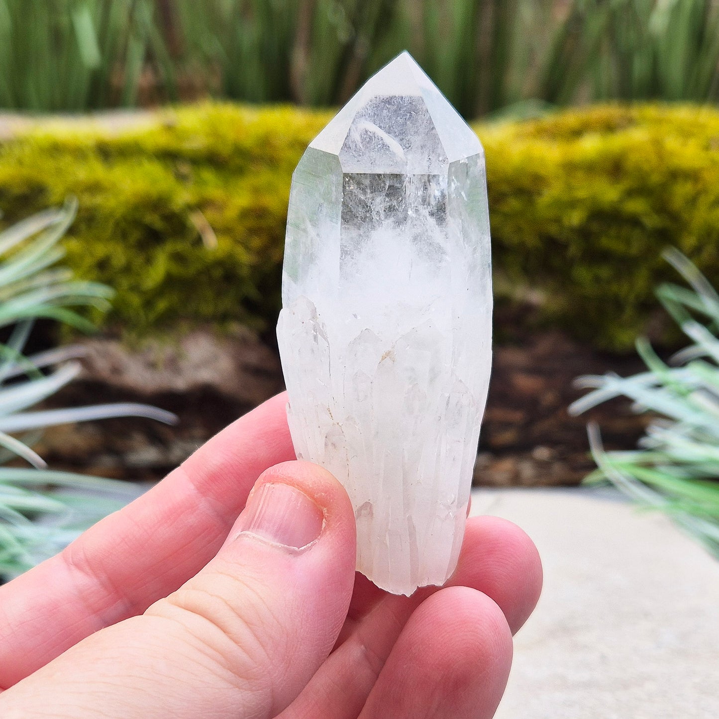 Quartz Crystal Point. From Atlas Mountains, Morocco. This is a wonderful natural quartz point with lots of companion crystals growing around it, very much like the formations you get on Pineapple Quartz.
