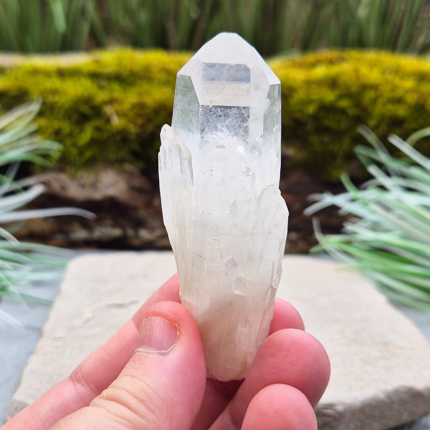 Quartz Crystal Point. From Atlas Mountains, Morocco. This is a wonderful natural quartz point with lots of companion crystals growing around it, very much like the formations you get on Pineapple Quartz.