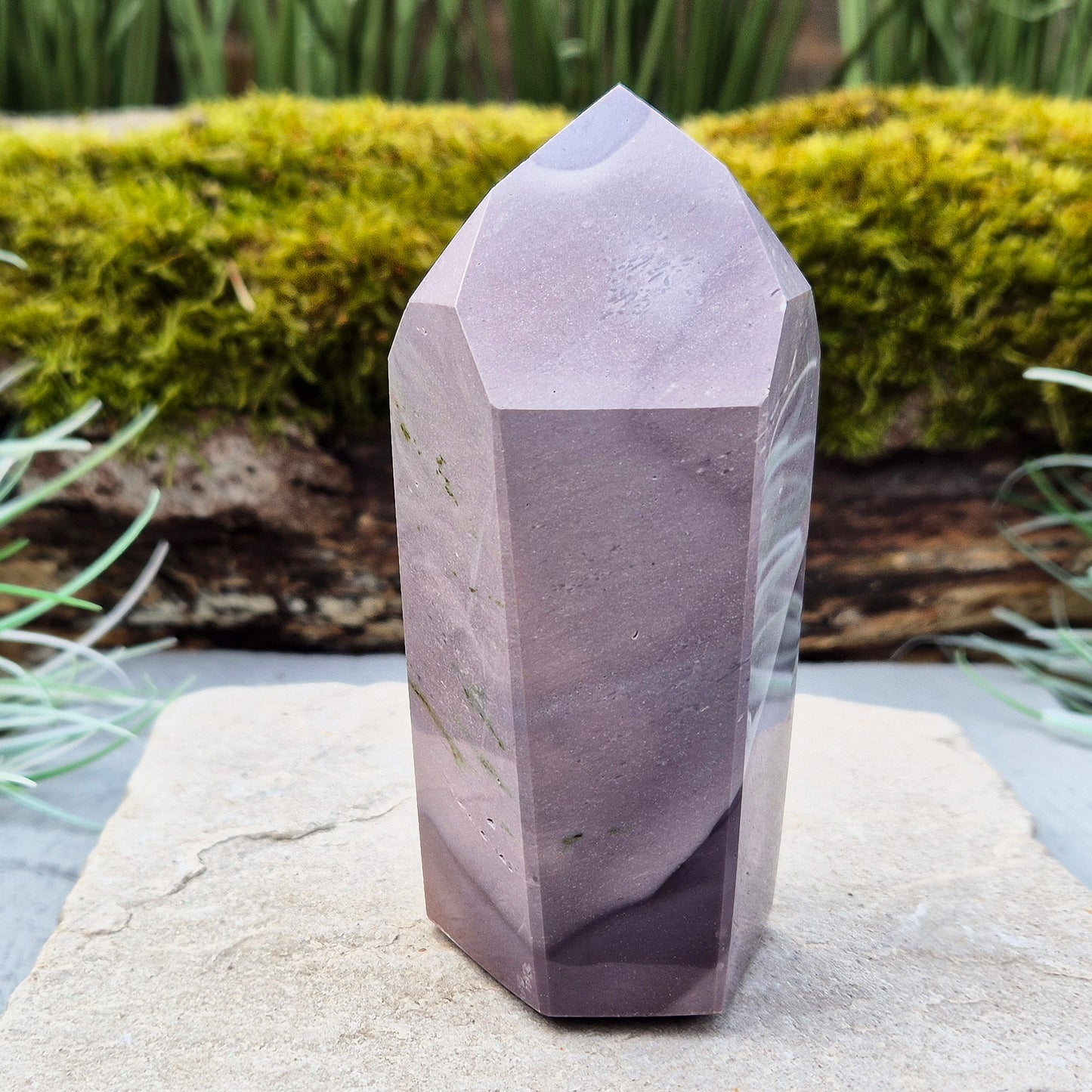 This striking Mookaite point features a rare purple gradient and a six-sided shape (7-3-7-3-7-3) that channels energy upward and outward. Known as a stone of strength, adaptability, and calm focus, Mookaite supports grounded growth and helps you move through change with confidence and ease.