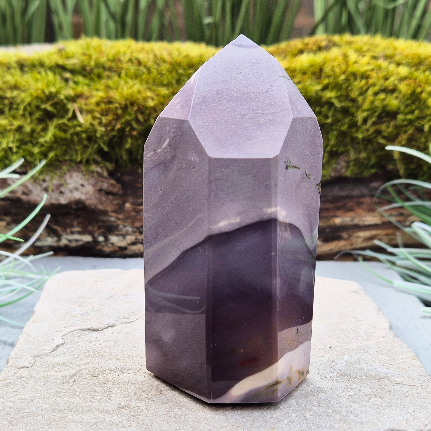 This striking Mookaite point features a rare purple gradient and a six-sided shape (7-3-7-3-7-3) that channels energy upward and outward. Known as a stone of strength, adaptability, and calm focus, Mookaite supports grounded growth and helps you move through change with confidence and ease.