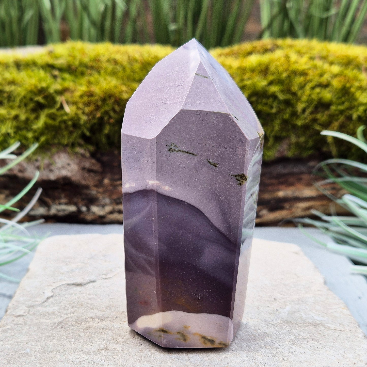 This striking Mookaite point features a rare purple gradient and a six-sided shape (7-3-7-3-7-3) that channels energy upward and outward. Known as a stone of strength, adaptability, and calm focus, Mookaite supports grounded growth and helps you move through change with confidence and ease.