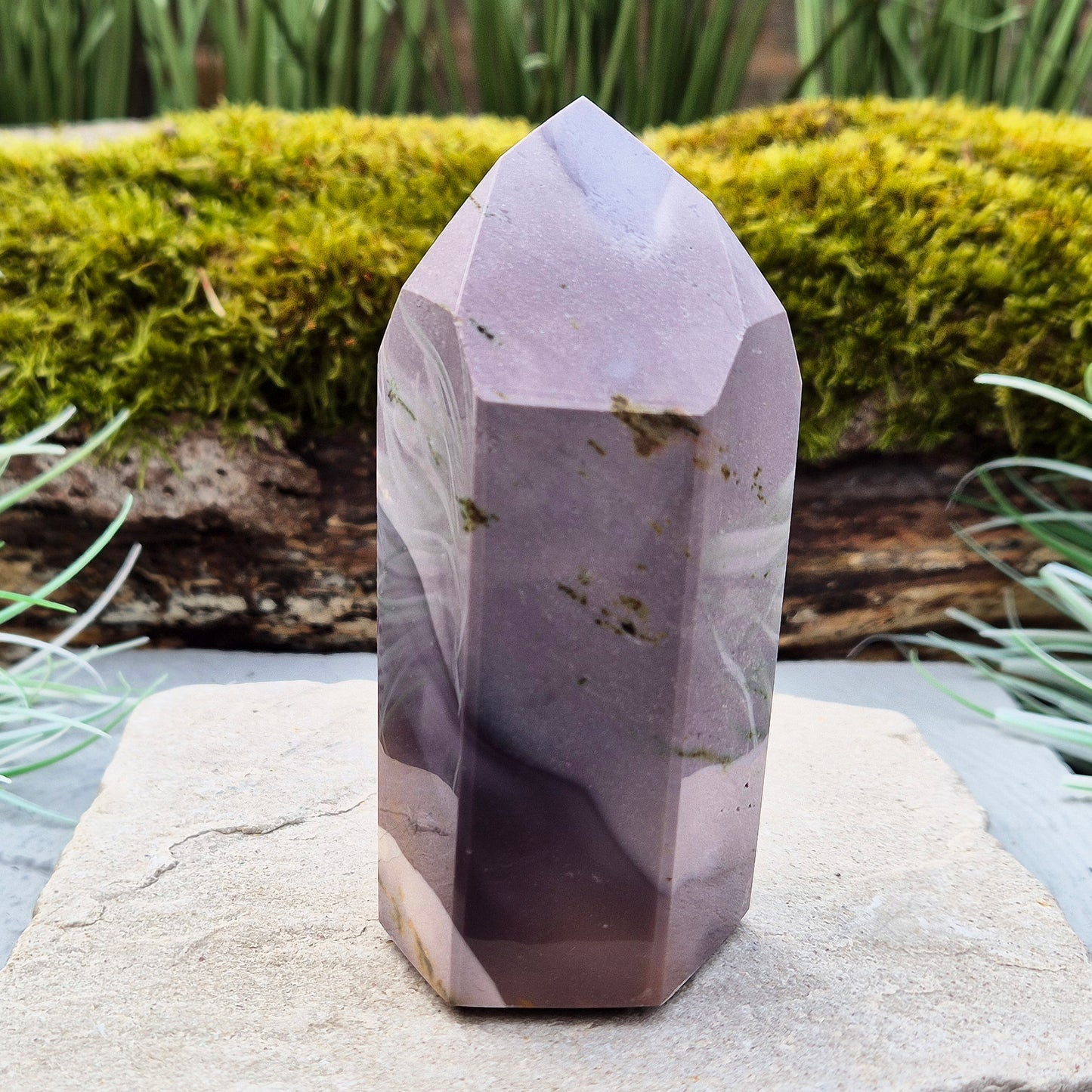 This striking Mookaite point features a rare purple gradient and a six-sided shape (7-3-7-3-7-3) that channels energy upward and outward. Known as a stone of strength, adaptability, and calm focus, Mookaite supports grounded growth and helps you move through change with confidence and ease.