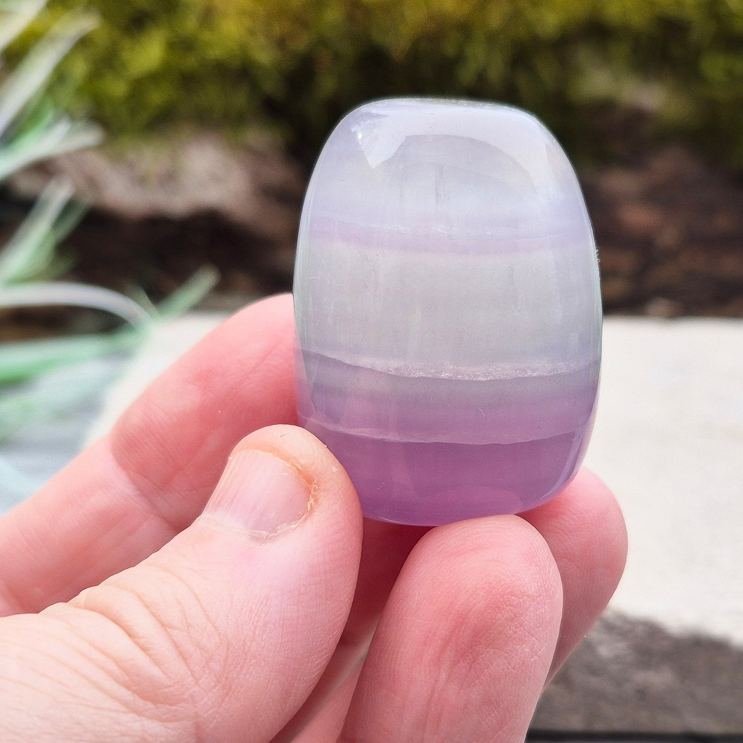 Lilac Fluorite Crystal. Lilac Fluorite also known as Lavender Fluorite is often described as a "balancing bridge" between the heart and the higher mind