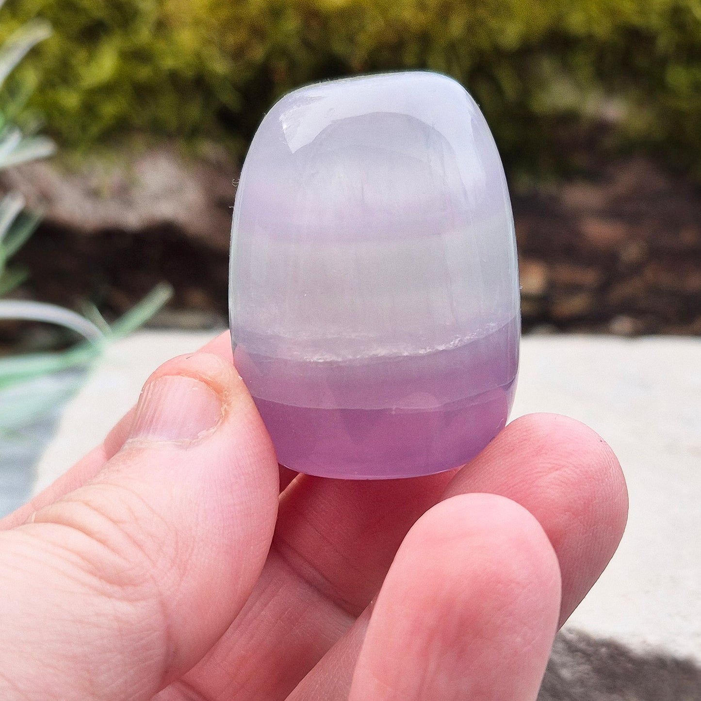 Lilac Fluorite Crystal. Lilac Fluorite also known as Lavender Fluorite is often described as a "balancing bridge" between the heart and the higher mind