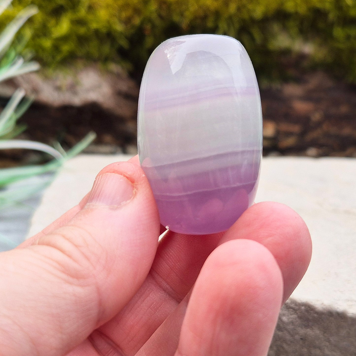 Lilac Fluorite Crystal. Lilac Fluorite also known as Lavender Fluorite is often described as a "balancing bridge" between the heart and the higher mind