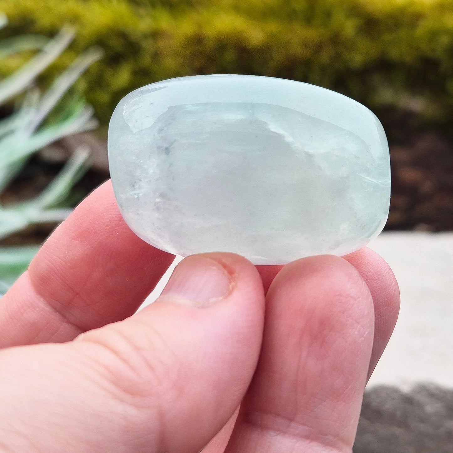 Green Fluorite Crystal. This crystal features a smooth, polished barrel-like shape with softly rounded edges, and will stand upright. From China.
