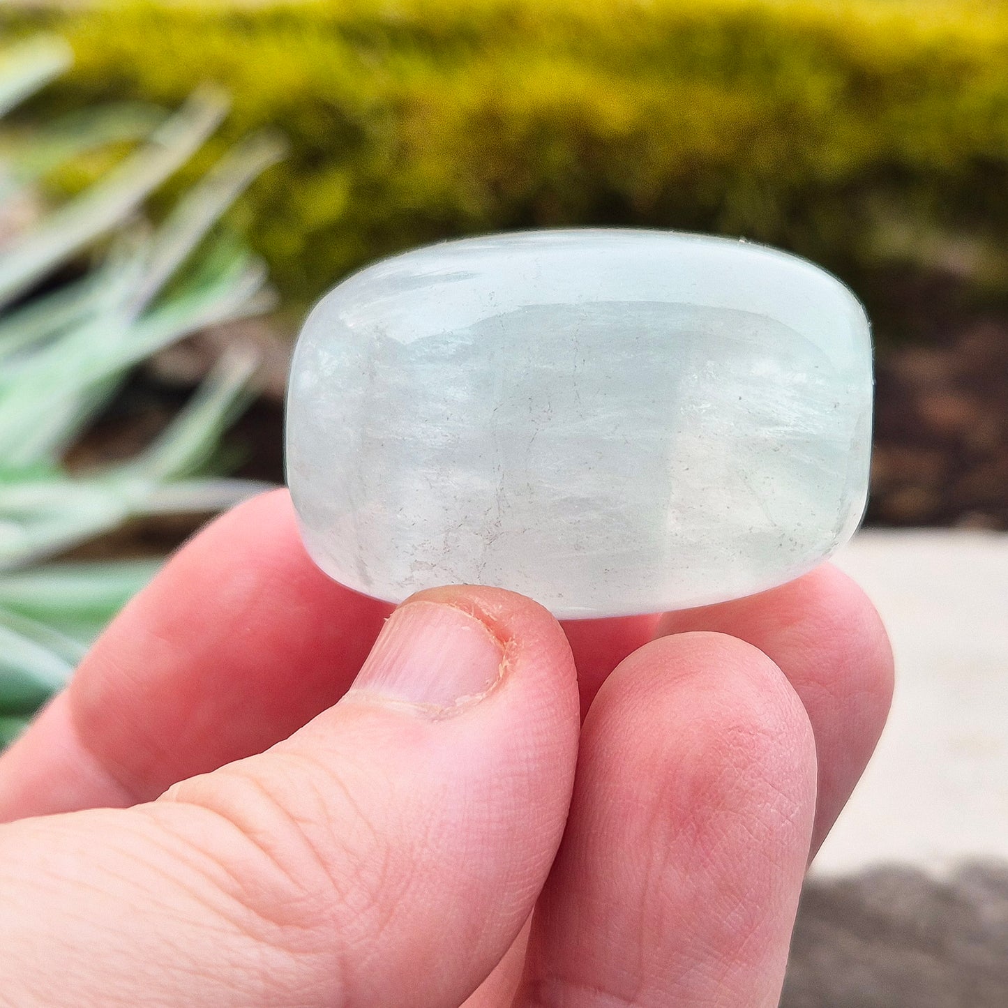 Green Fluorite Crystal. This crystal features a smooth, polished barrel-like shape with softly rounded edges, and will stand upright. From China.