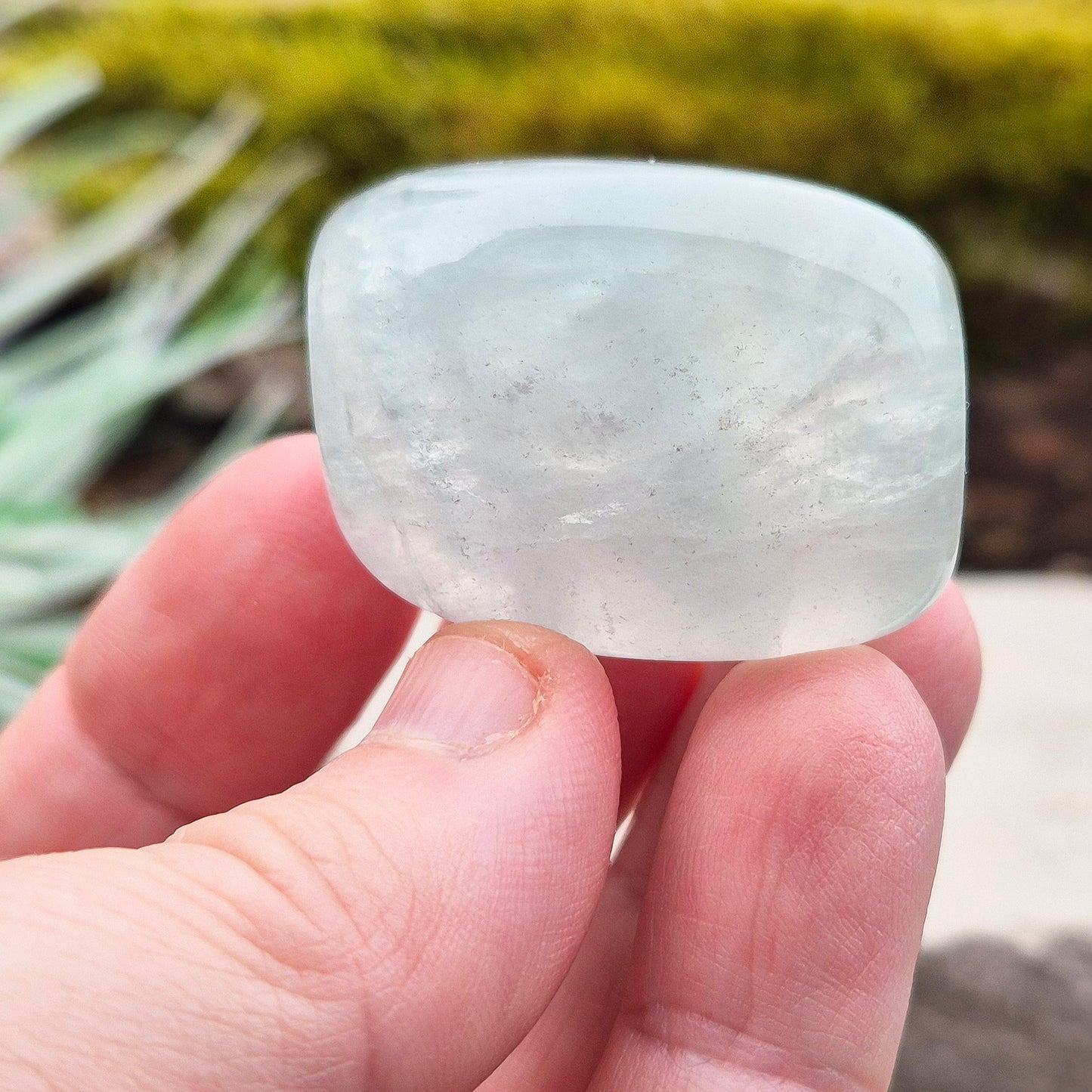 Green Fluorite Crystal. This crystal features a smooth, polished barrel-like shape with softly rounded edges, and will stand upright. From China.