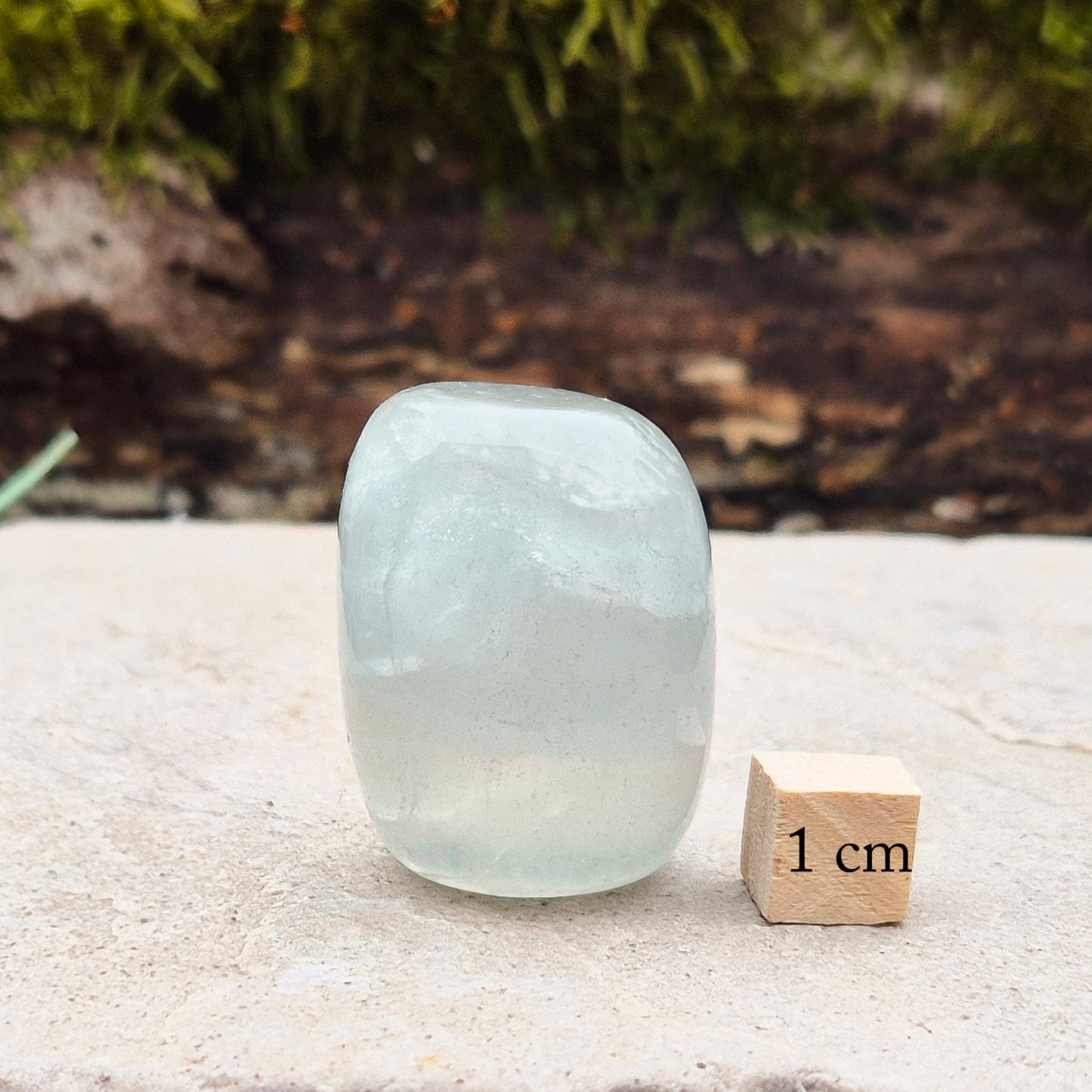 Green Fluorite Crystal. This crystal features a smooth, polished barrel-like shape with softly rounded edges, and will stand upright. From China.