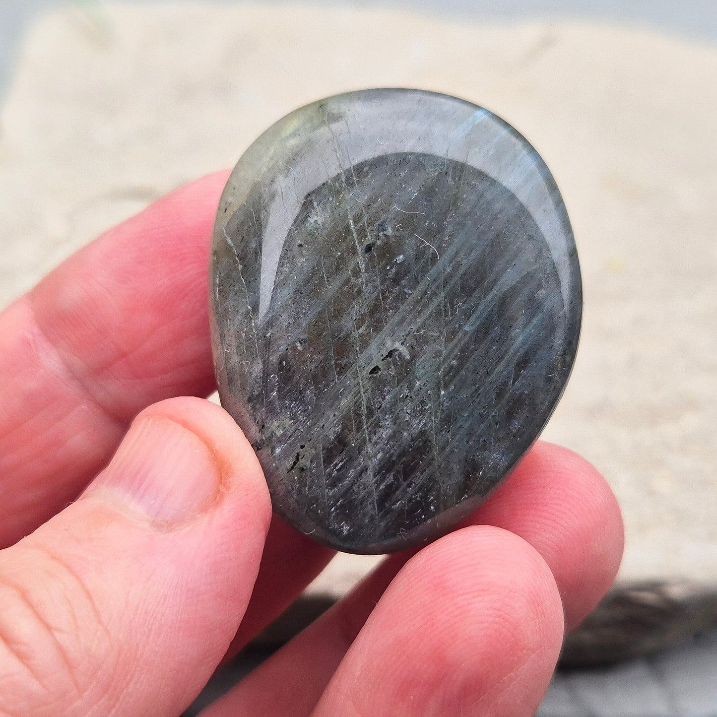 Labradorite Crystal Palm Stone, also known as Spectrolite. From Madagaascar. Has a lovely blue, yellow, gold, pinky purple flash when in the light at certain angles.