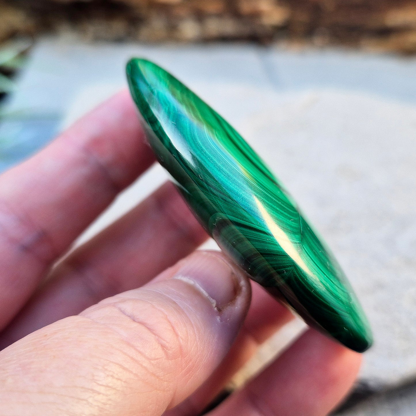 Malachite Crystal Palm Stone from the Congo. Polished Malachite which has wonderful green markings. Grade AA.