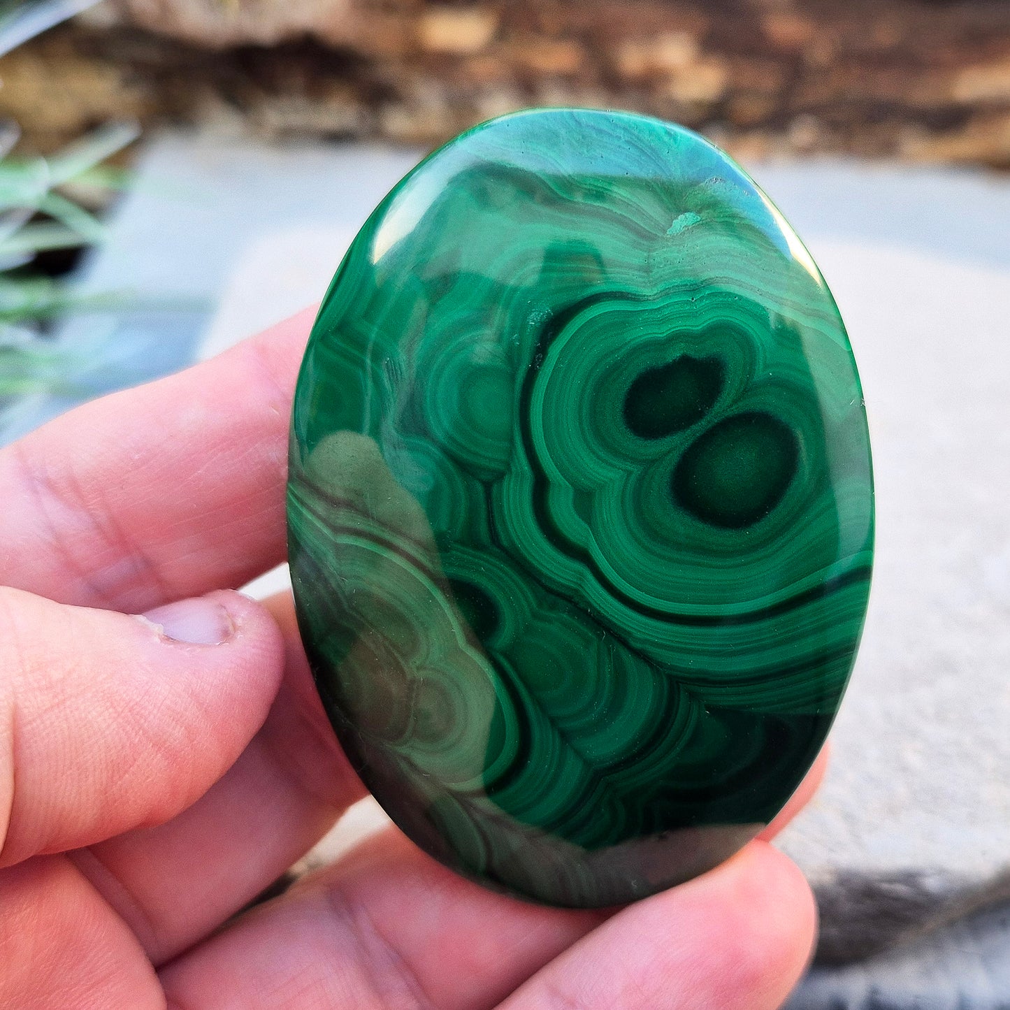 Malachite Crystal Palm Stone from the Congo. Polished Malachite which has wonderful green markings. Grade AA.