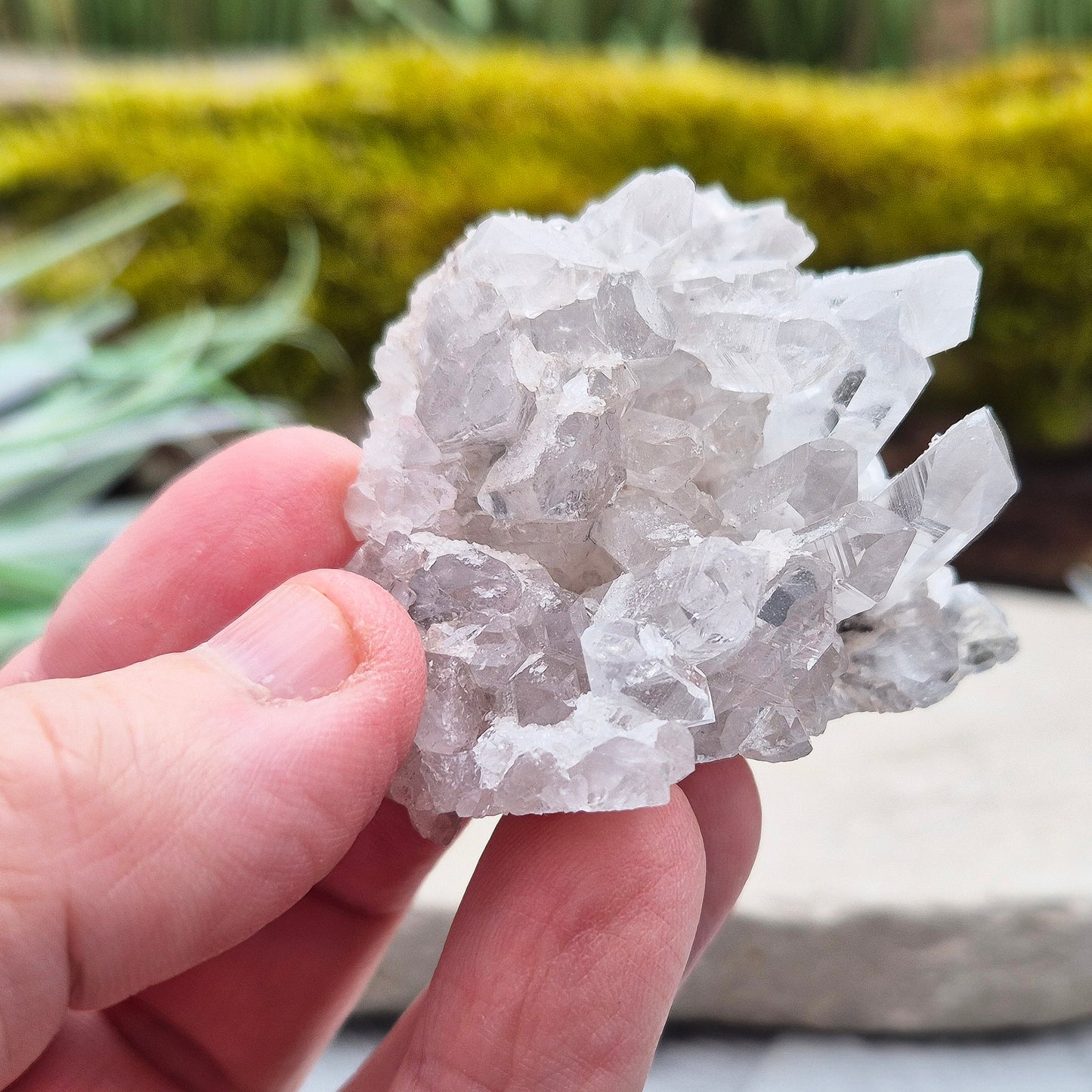 Quartz Crystal Cluster. Guangdong Province, China. This cluster comprises of needle like quartz points. Has a flat base so will self stand.