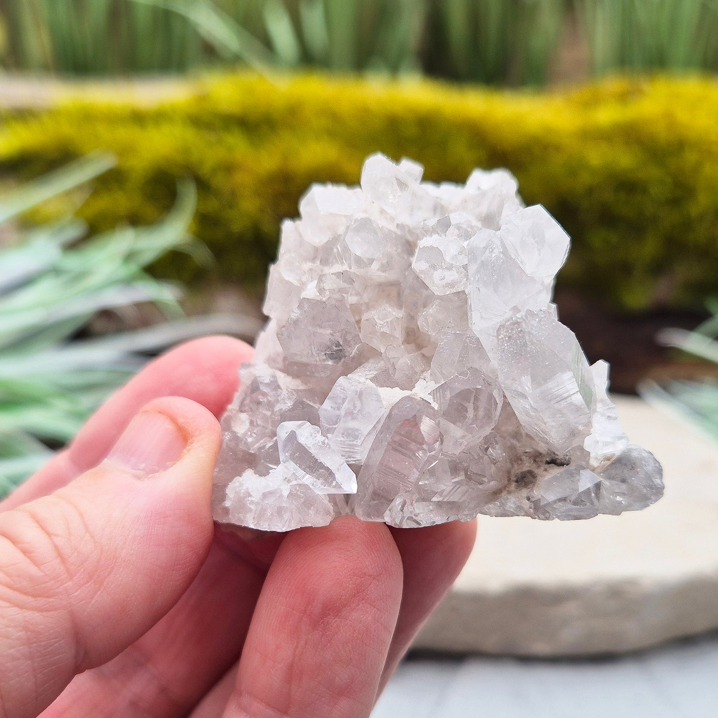 Quartz Crystal Cluster. Guangdong Province, China. This cluster comprises of needle like quartz points. Has a flat base so will self stand.