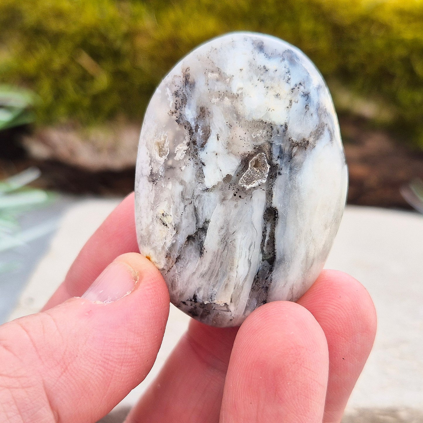Shop Dendritic Opal Palm Stones for grounding, intuition, and spiritual growth. Handcrafted, polished, and energy-cleansed crystals from Madagascar.