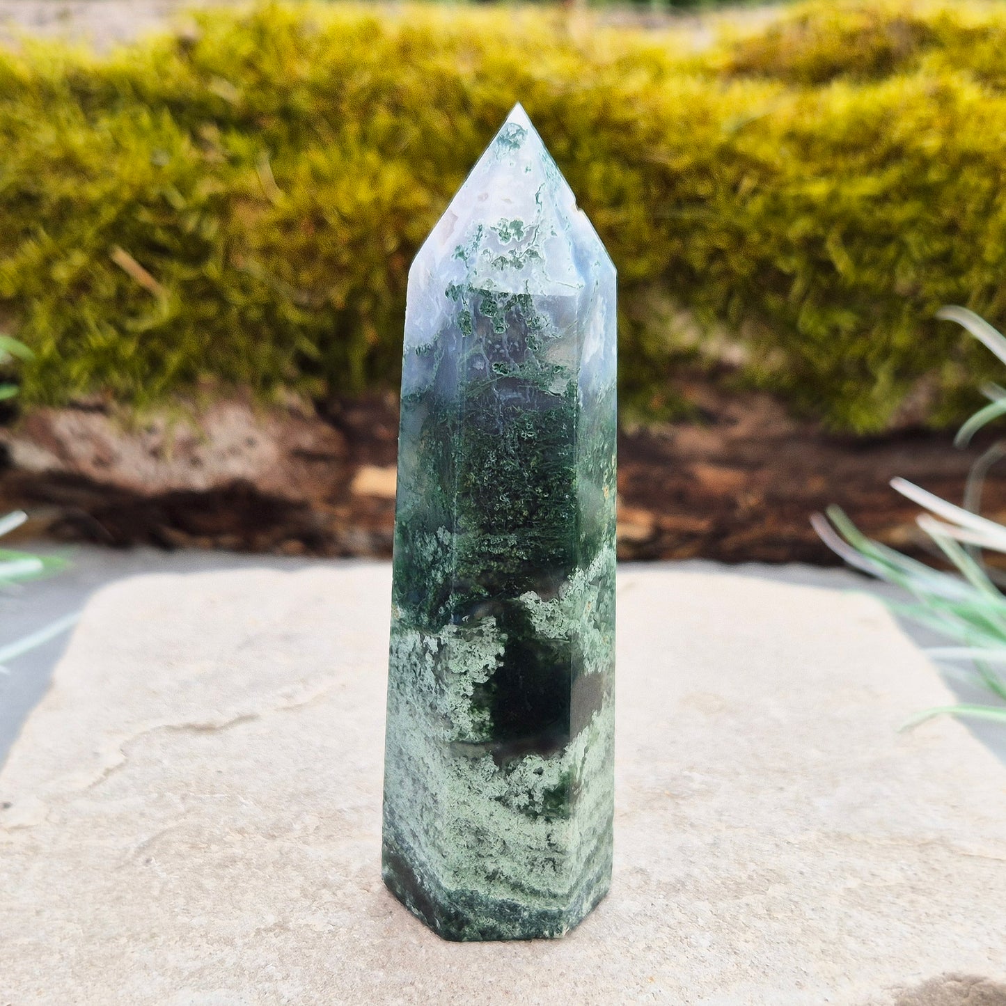 This exquisite Moss Agate Tower features a 6 sided Generator tip, polished surface with unique moss-like inclusions, creating a captivating natural design.
