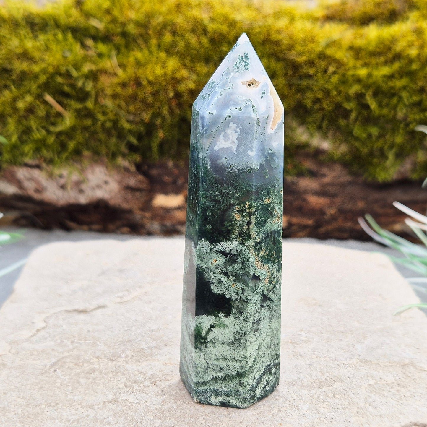 This exquisite Moss Agate Tower features a 6 sided Generator tip, polished surface with unique moss-like inclusions, creating a captivating natural design.