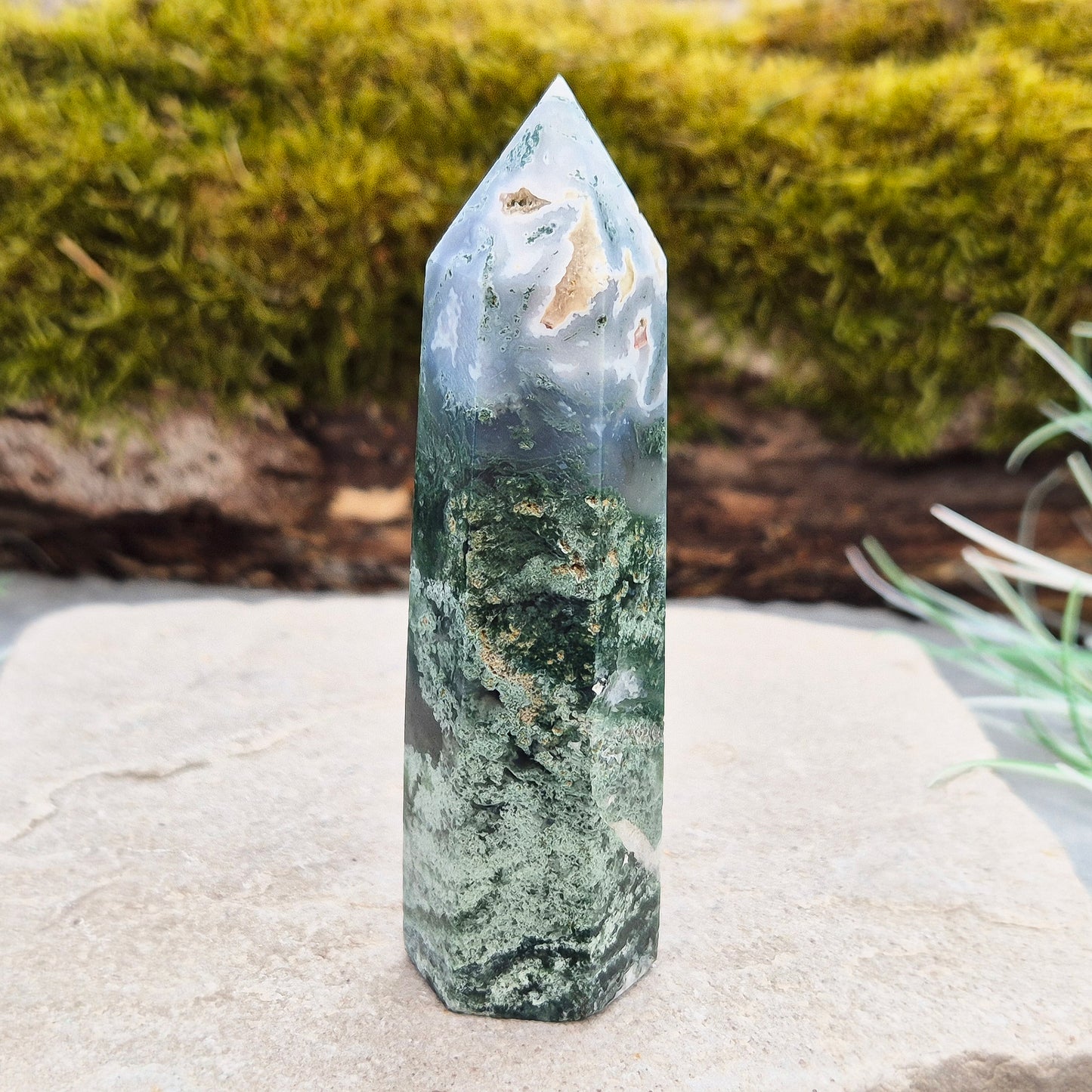 This exquisite Moss Agate Tower features a 6 sided Generator tip, polished surface with unique moss-like inclusions, creating a captivating natural design.