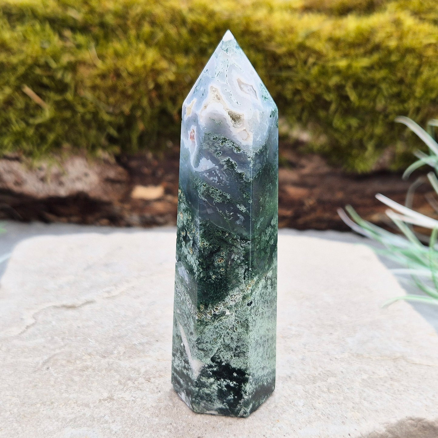 This exquisite Moss Agate Tower features a 6 sided Generator tip, polished surface with unique moss-like inclusions, creating a captivating natural design.